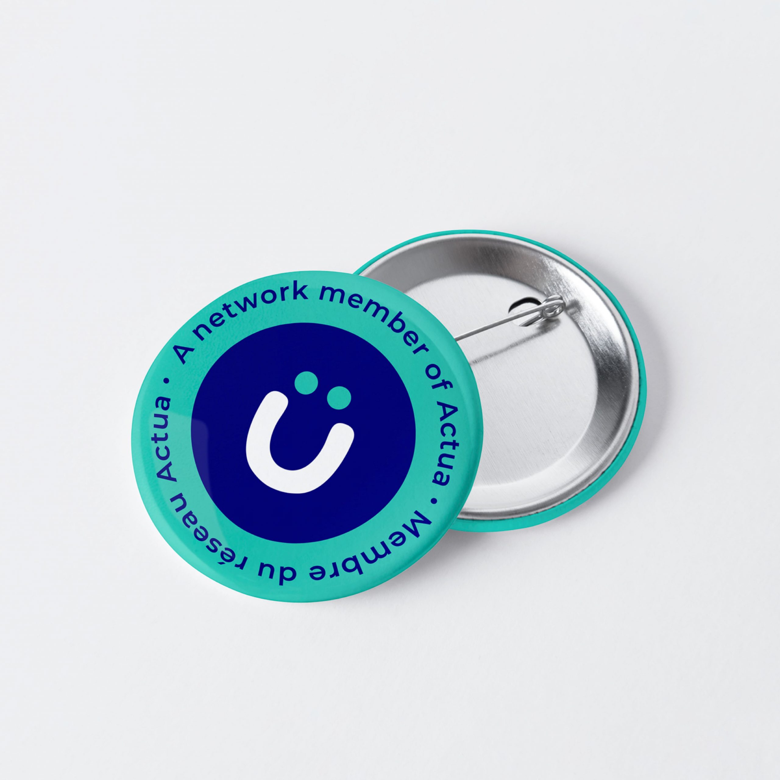 Actua's teal and blue button.