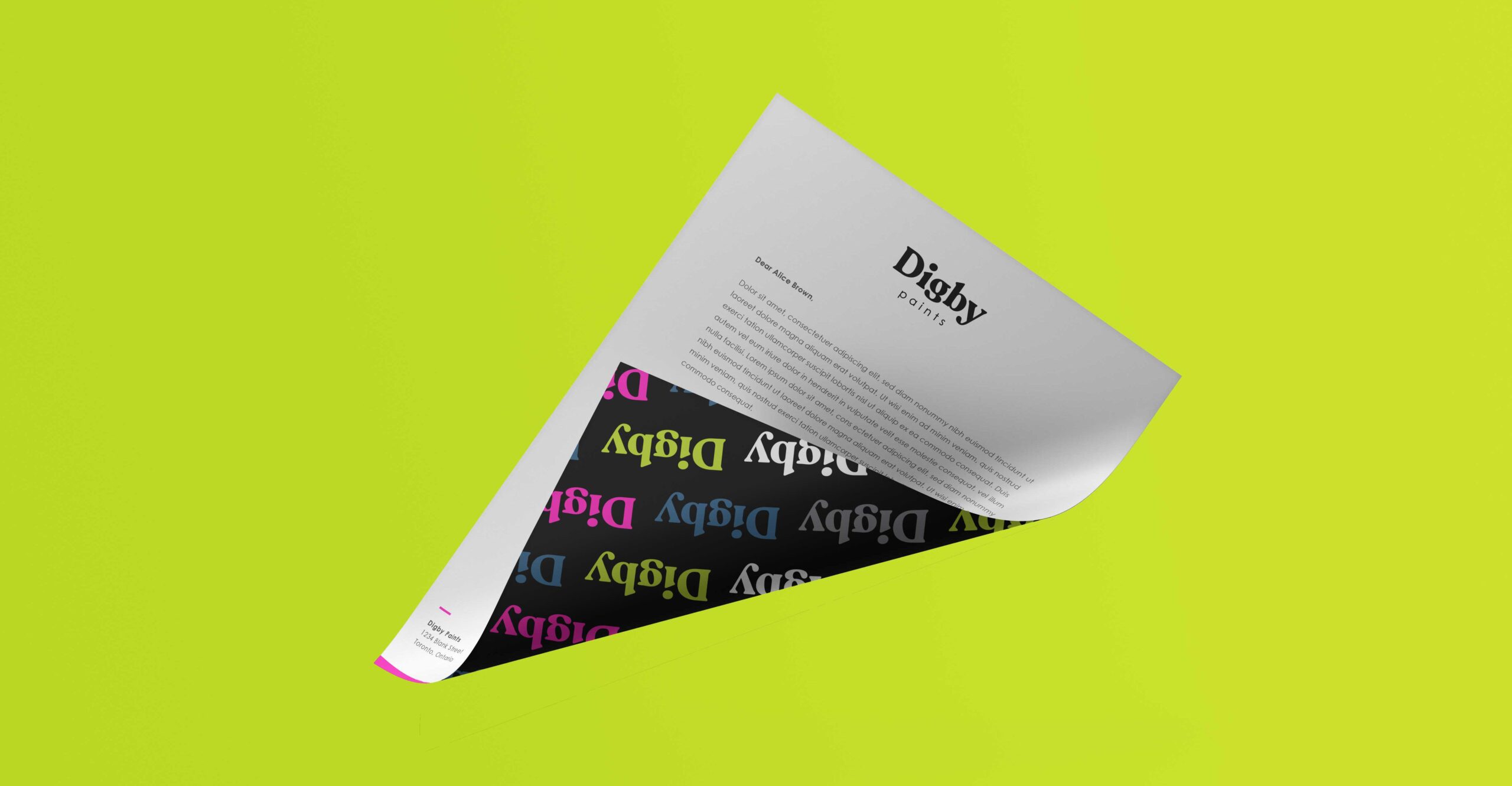 A Digby titled letter folded in the air, revealing a black second page with a multi-colour Digby pattern