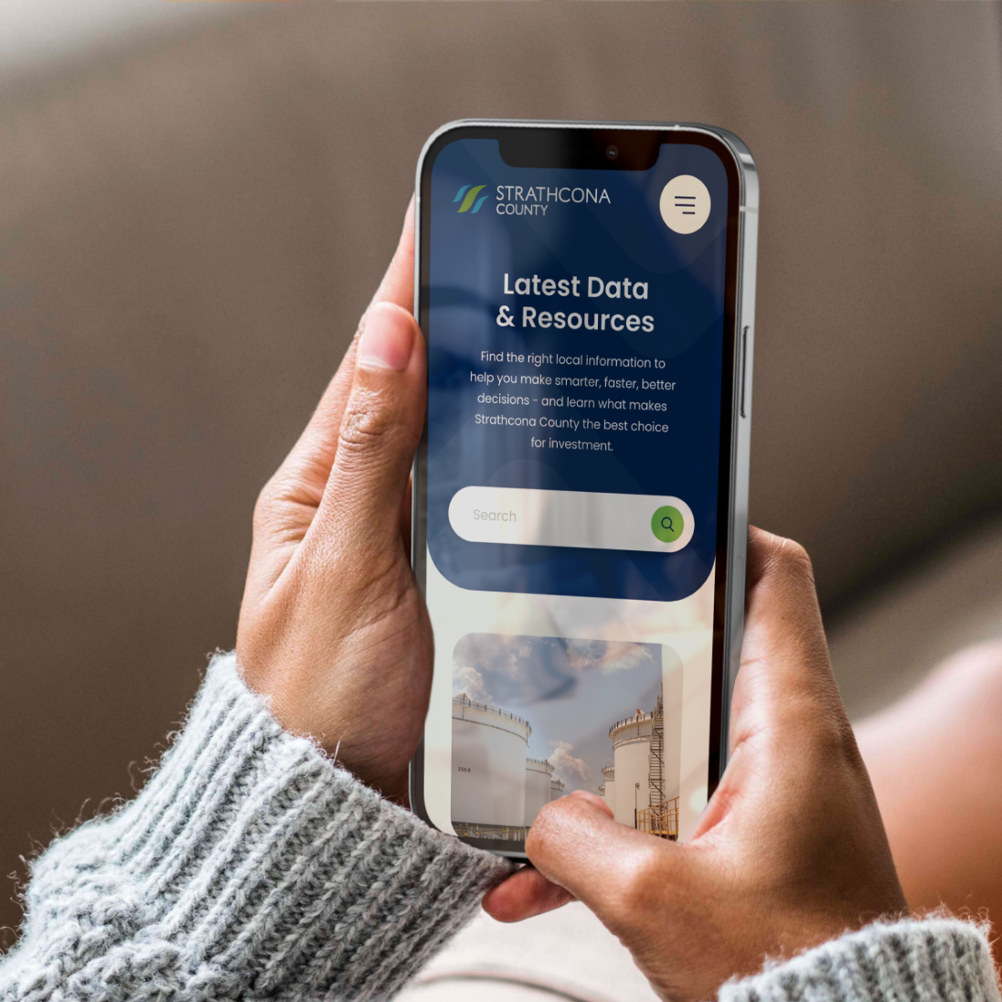 A user views the Strathcona County website on their smartphone.