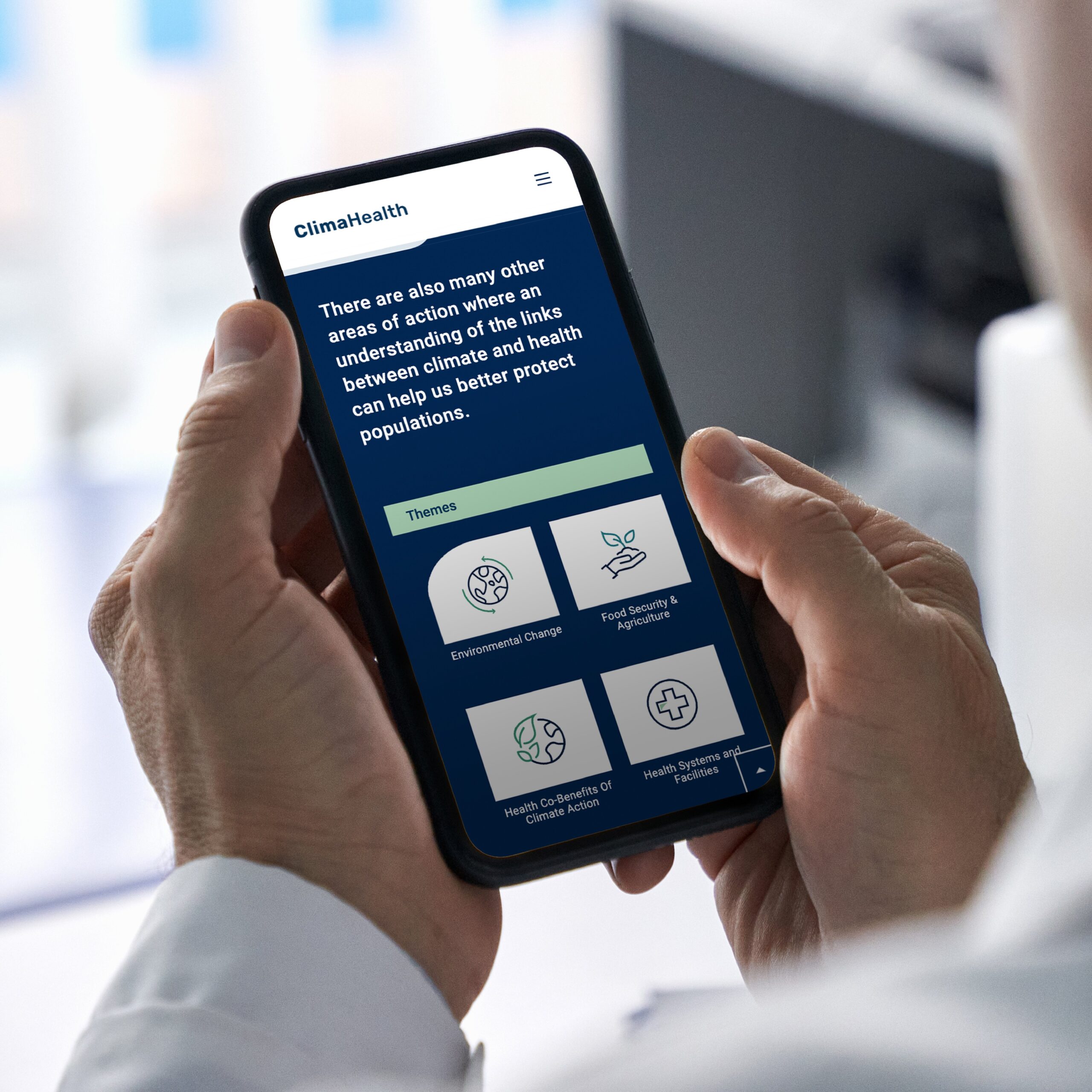 Hands holding mobile phone that show ClimaHealth theme icons
