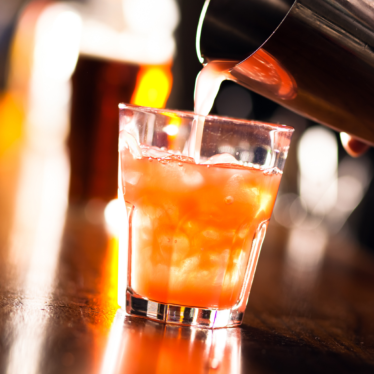 Drink being poured out of shaker