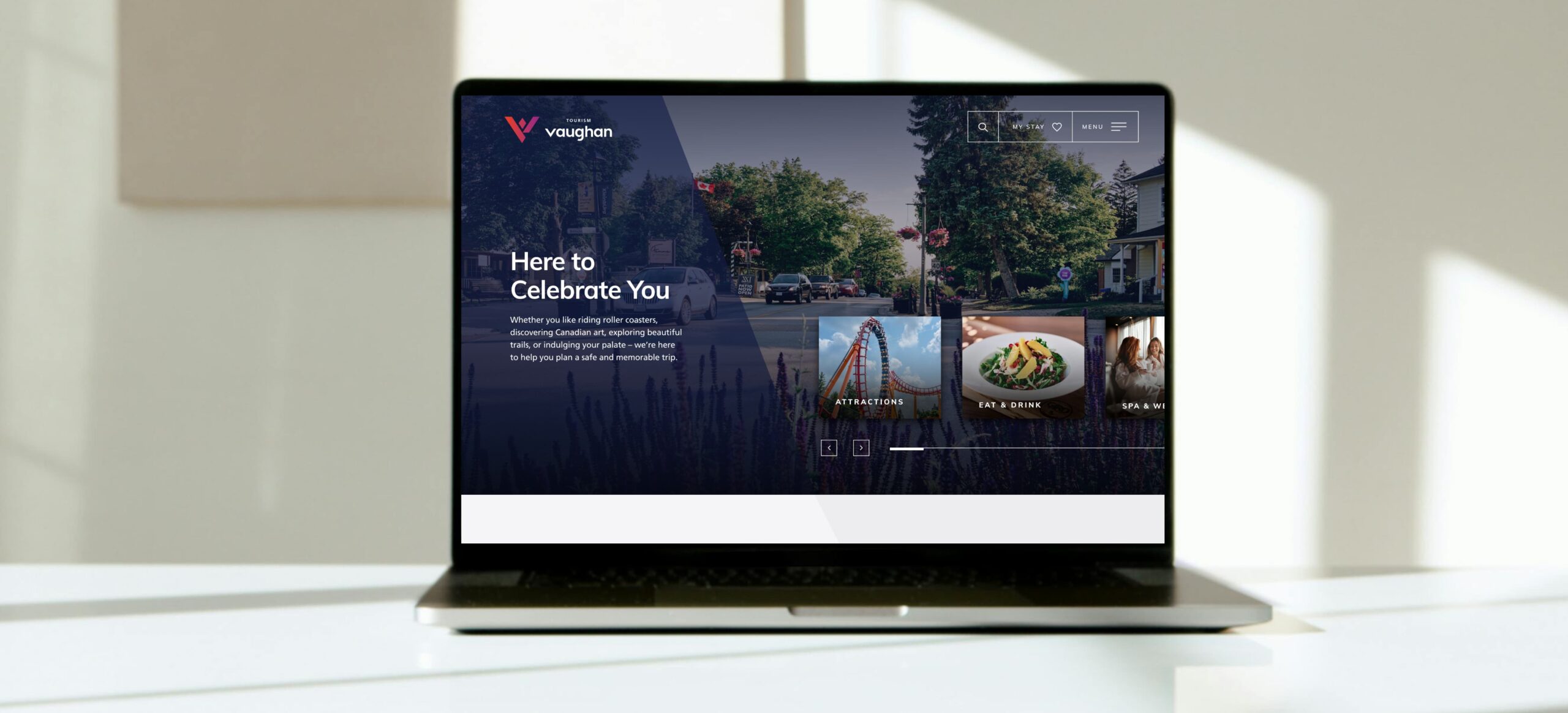 Tourism Vaughan website on laptop.
