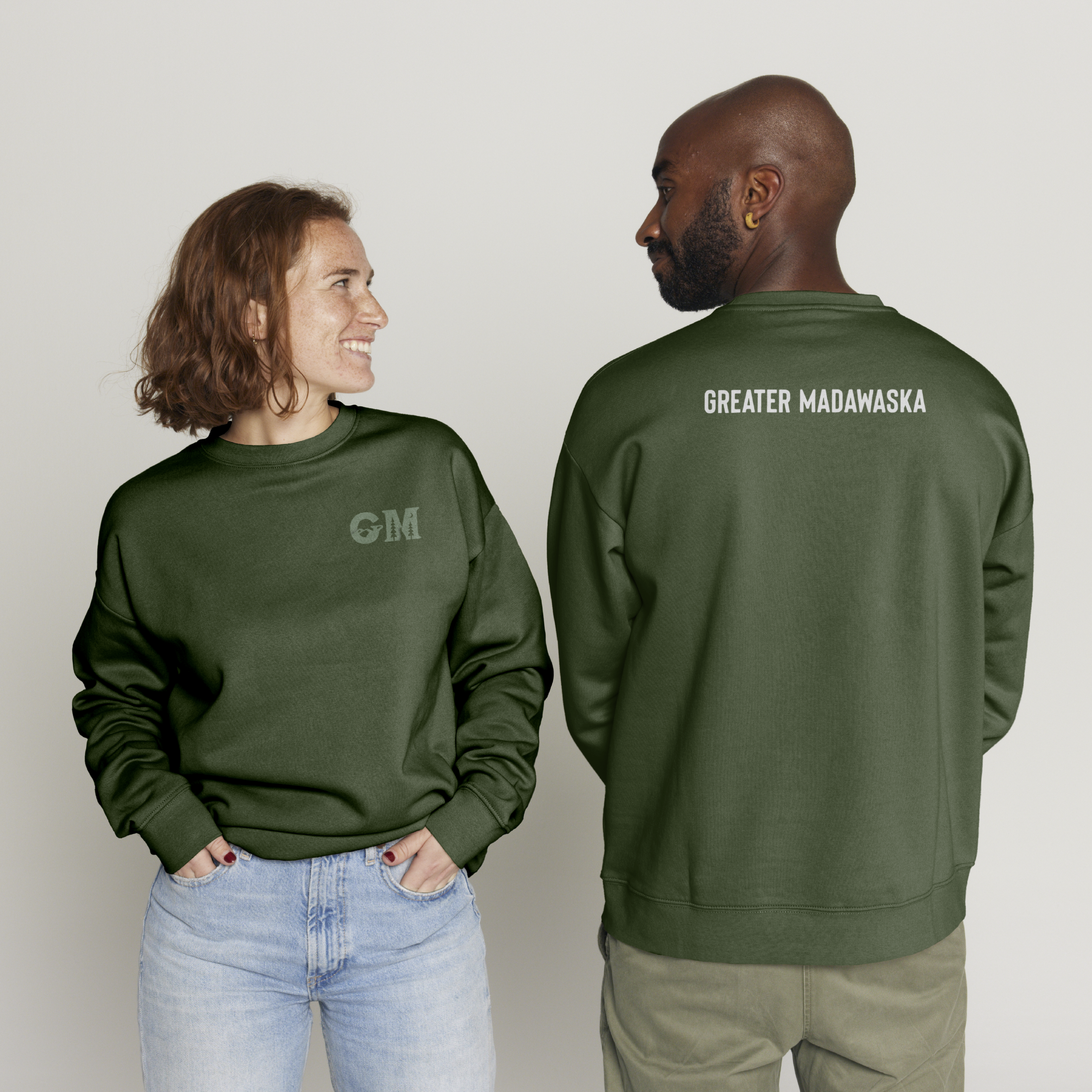 Greater Madawaska logo mock up on a sweater on male and female models