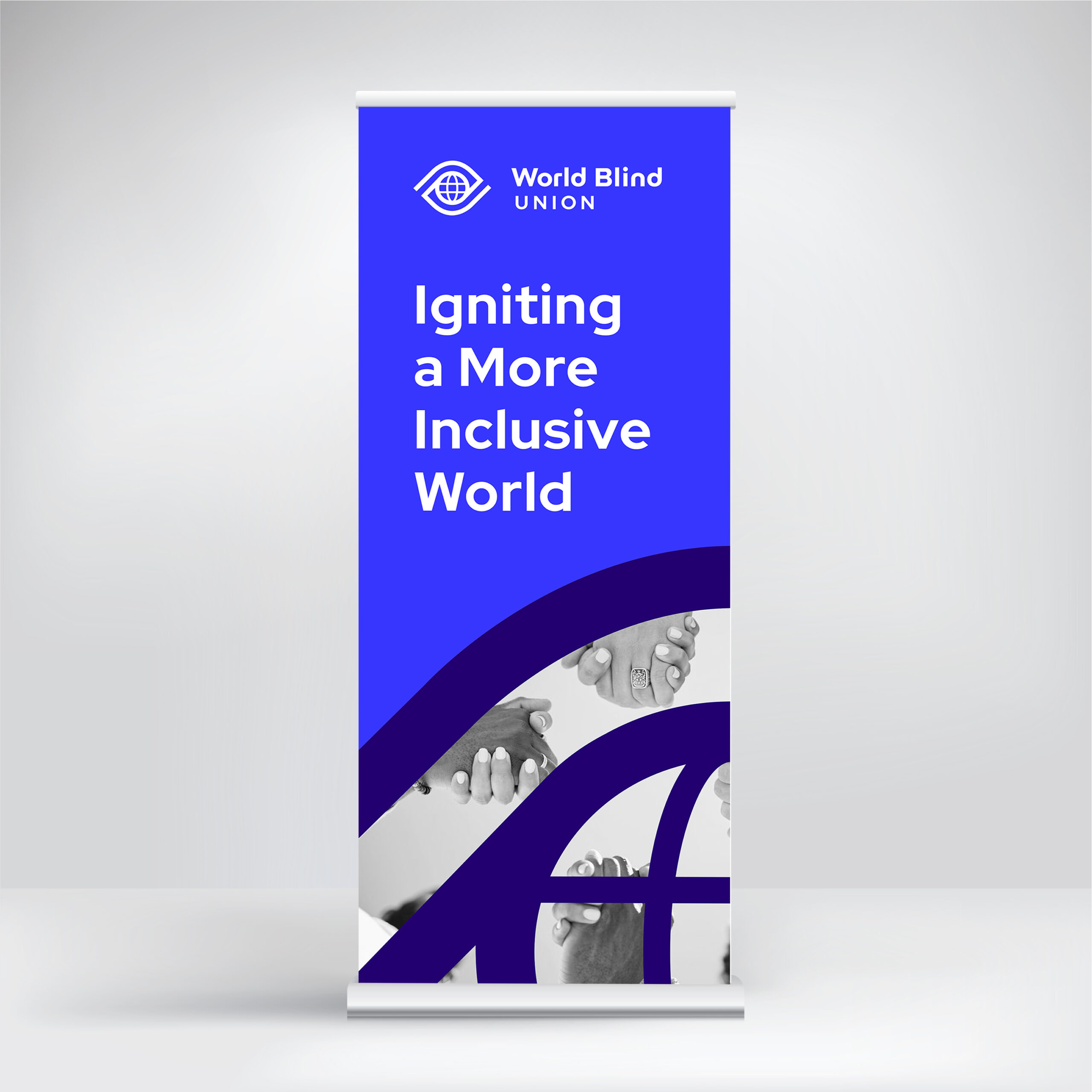 A World Blind Union banner reads "Igniting a More Inclusive World" with images of hands and abstract blue graphics.