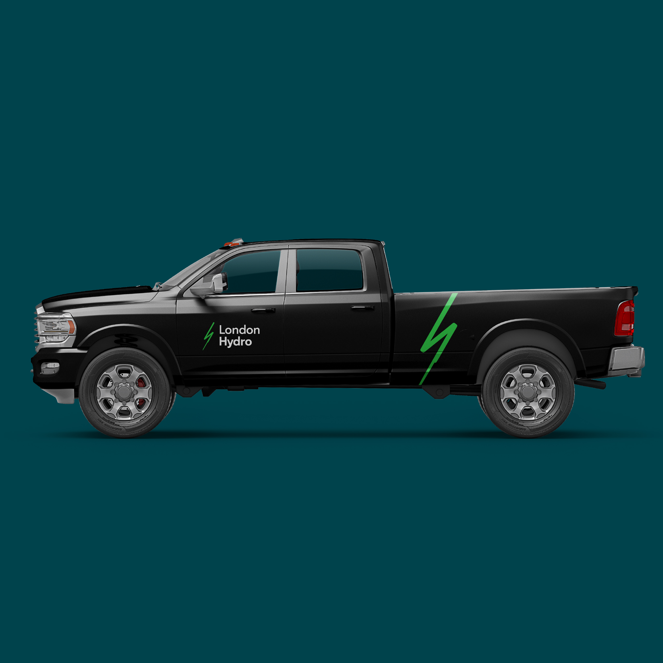 Black pickup lorry with "London Hydro" text and a green lightning bolt graphic on the side, shown on a teal background.